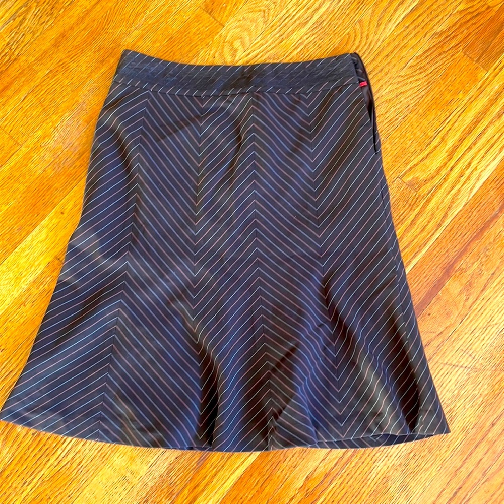 Brown skirt with pink and white zig zag stripes